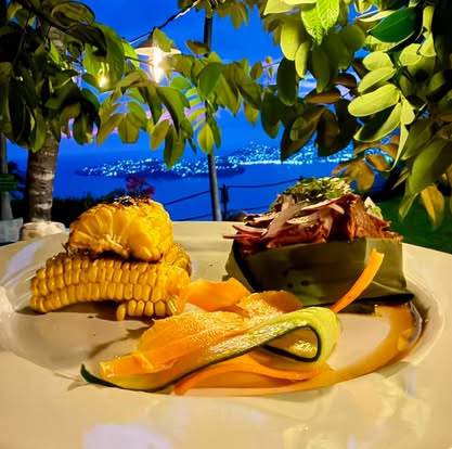 Plated dinner at El Refugio above the lights of Acapulco Bay